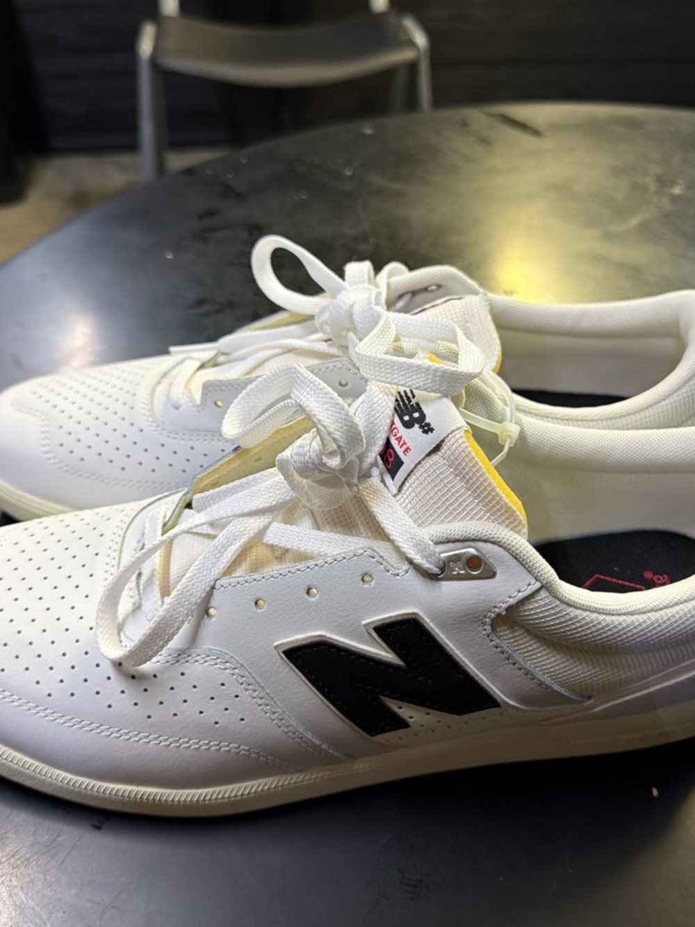 New Balance Men's White Leather Casual Sneakers with Black 'N' Logo
